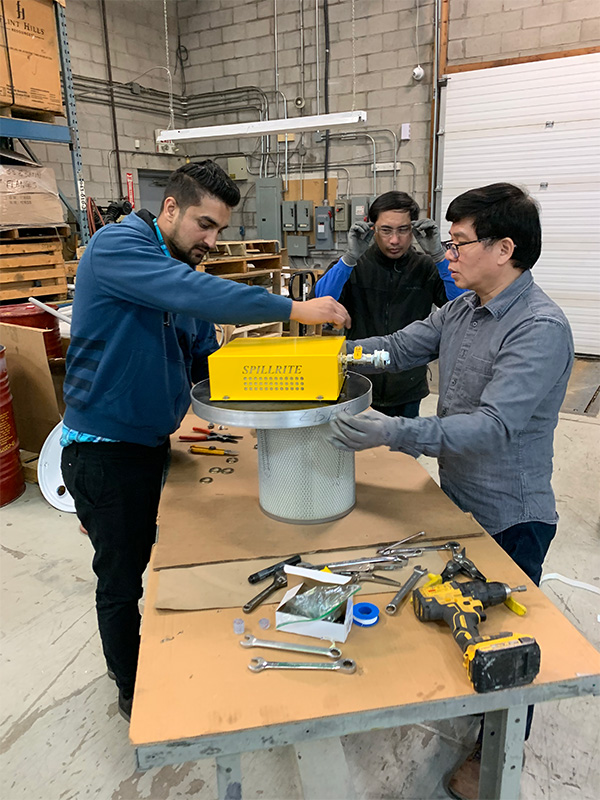 Technicians build air operated vacuum